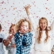 Kids in a room full of confetti